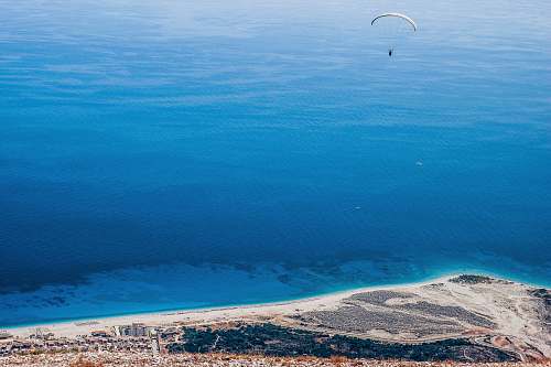 leisure activities parachute over island gliding